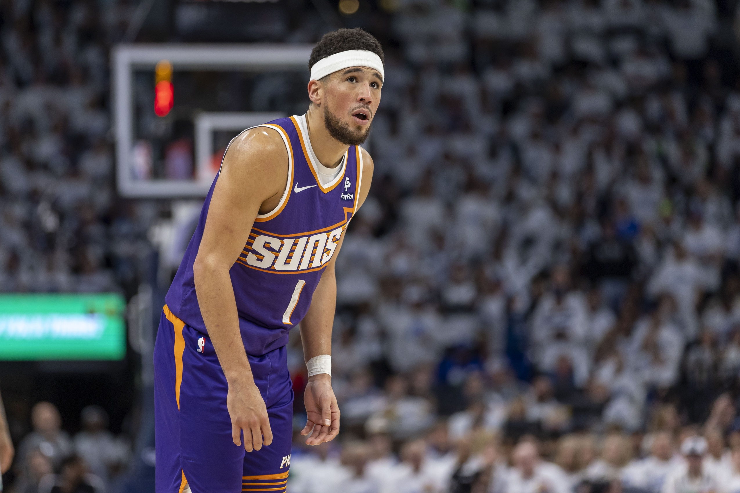  Phoenix Suns' Devin Booker Quells Trade Rumors Commitment to the Team Amidst Tumultuous Season