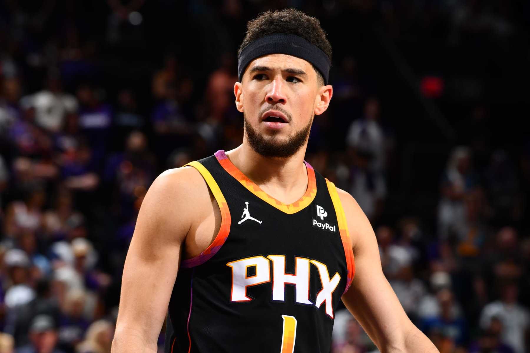  Phoenix Suns' Devin Booker Quells Trade Rumors Commitment to the Team Amidst Tumultuous Season