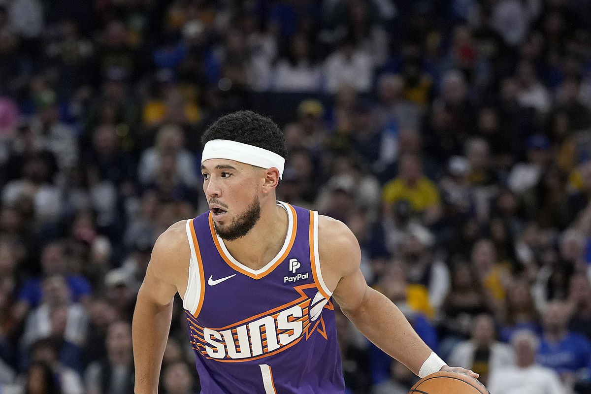 Phoenix Suns' Devin Booker Quells Trade Rumors Commitment to the Team Amidst Tumultuous Season